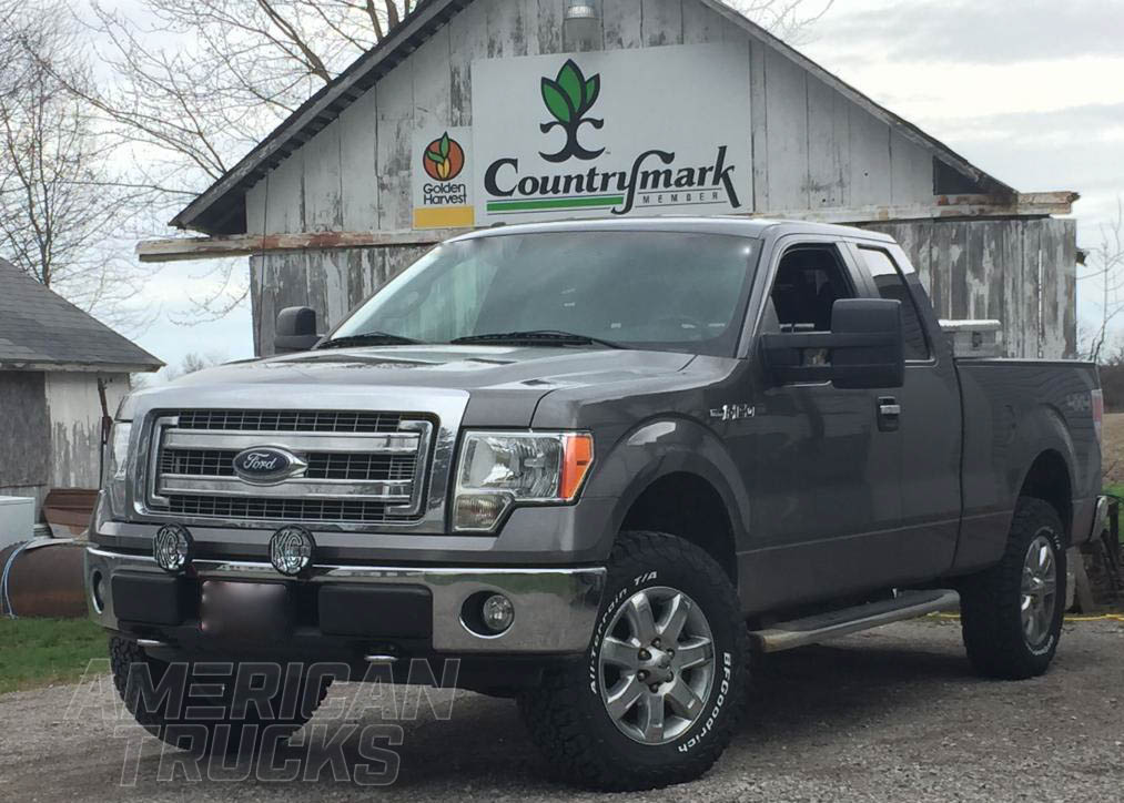 F150 with Towing Mirrors in Front of a Barn Shed