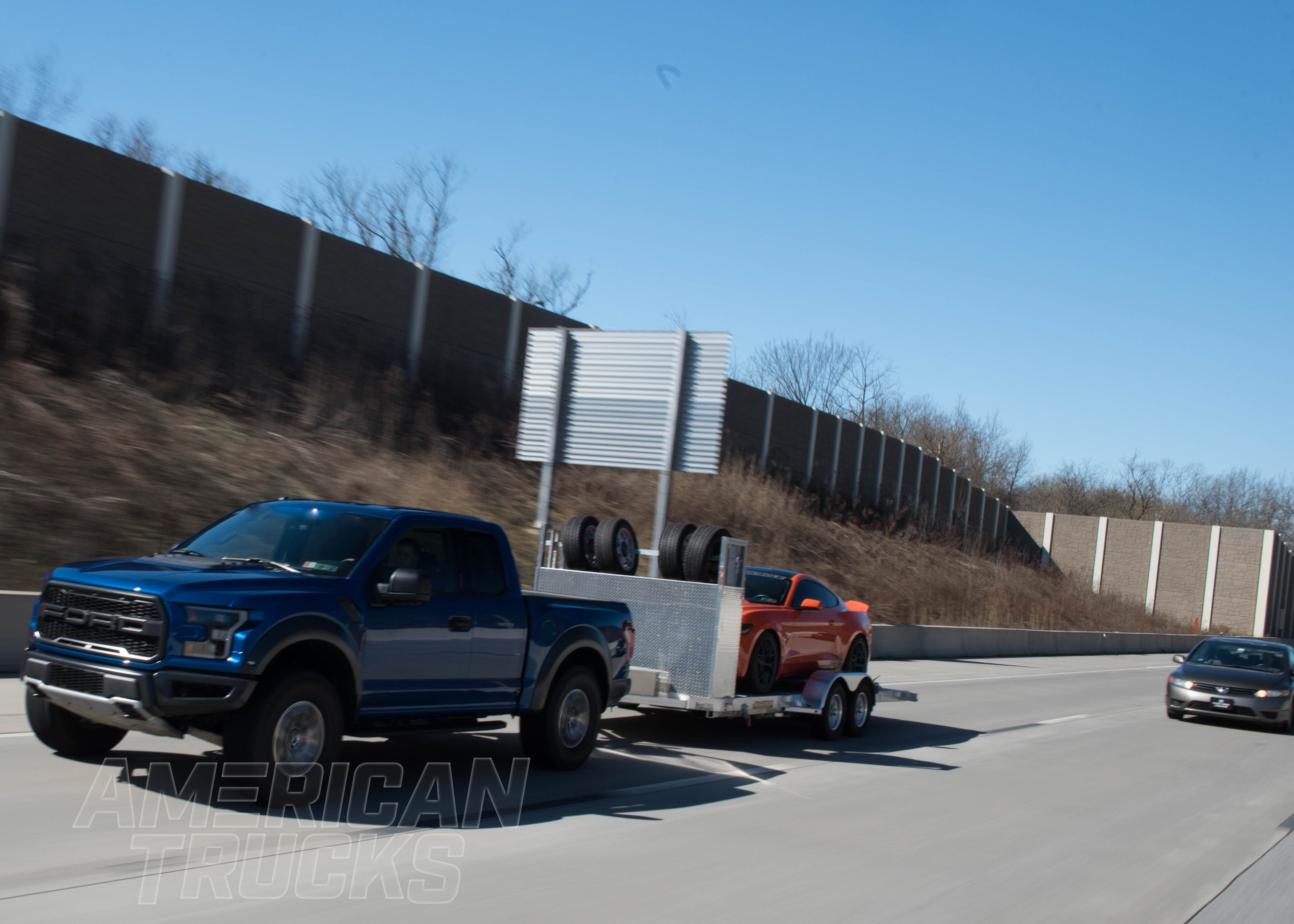 F150 with Adjustable Suspension Towing a Mustang